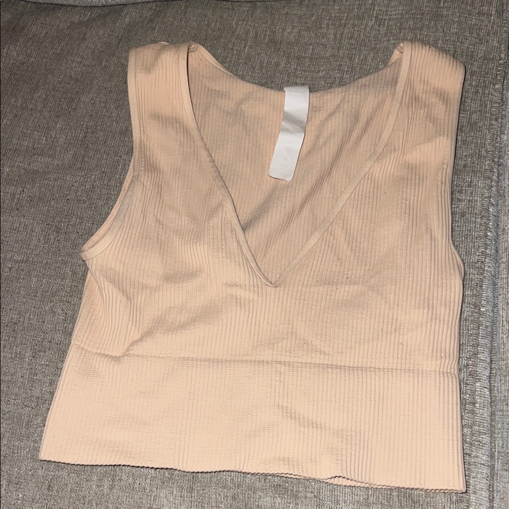 Work out tank top. Super cute coral/orange color. Bought from Marshall’s S/M!